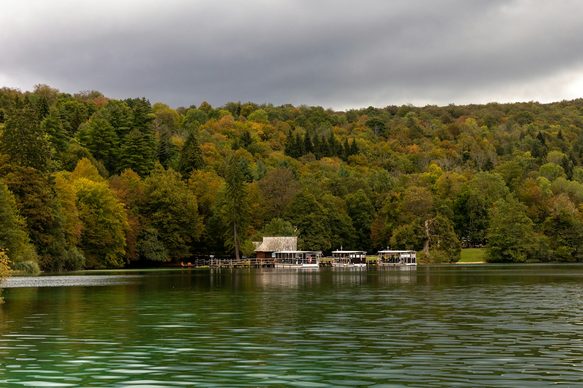 Park building beside frozen lake during winter at Plitvice Lakes National Park