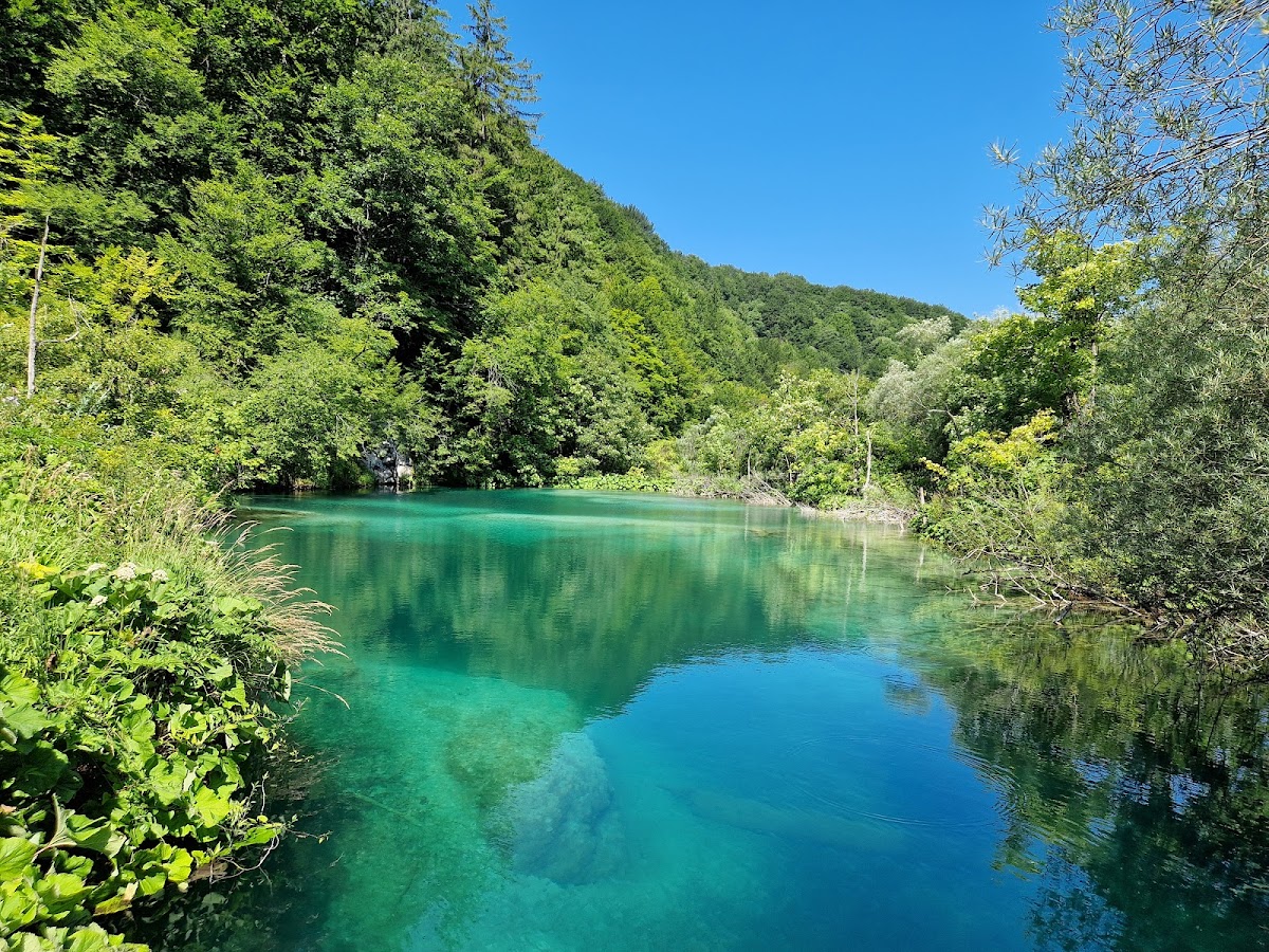 Multiple tiers of waterfalls cascading down rocky cliff